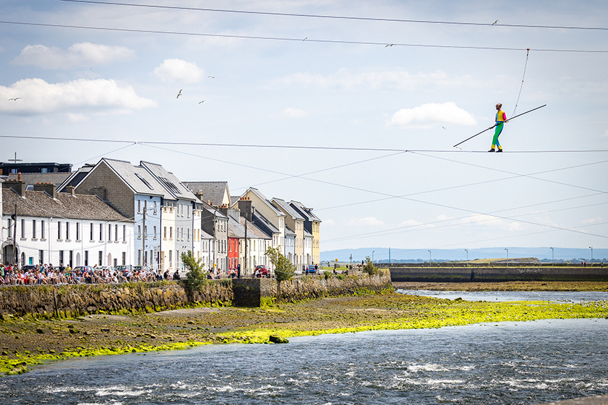 Highwire artist Ellis Grover walking the Corrib River wire at LifeLine. Photo by Emilija Jefremova.