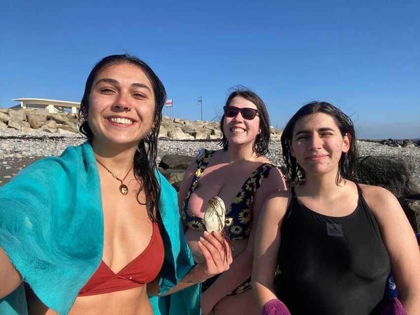 Aline and fellow ESC volunteers Gemma and Gokce at the sea in Galway