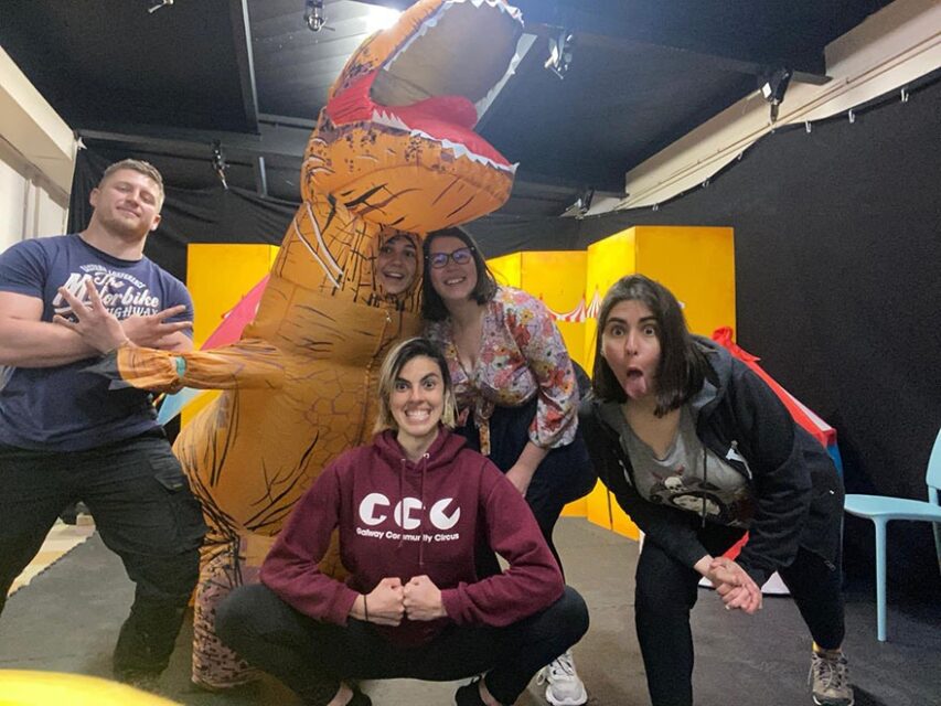 Aline with her colleagues (and a dinosaur) at Galway Community Circus